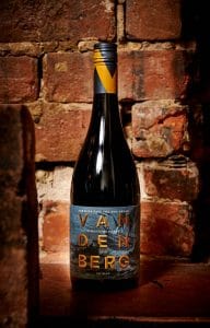 Bottle of Vandenberg Ari Shiraz in front of a brick wall